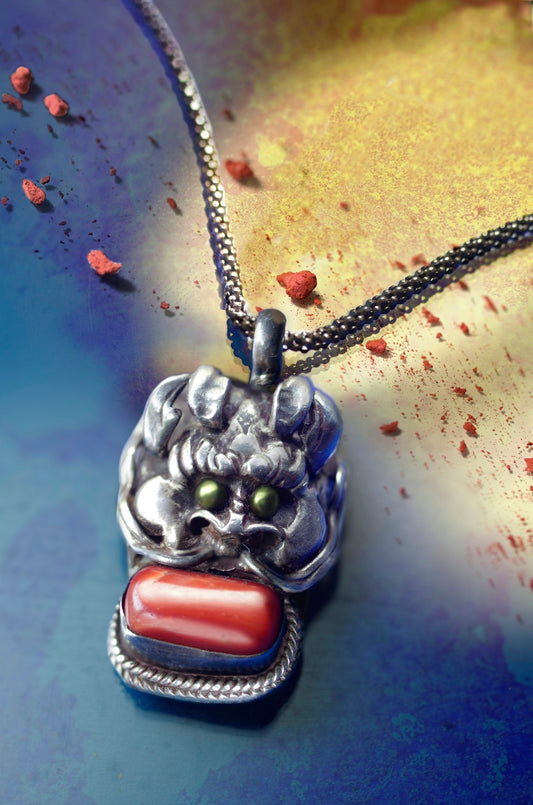 silver dragon with red cabochon pendant