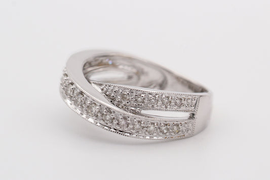 silver diamond ring on white surface