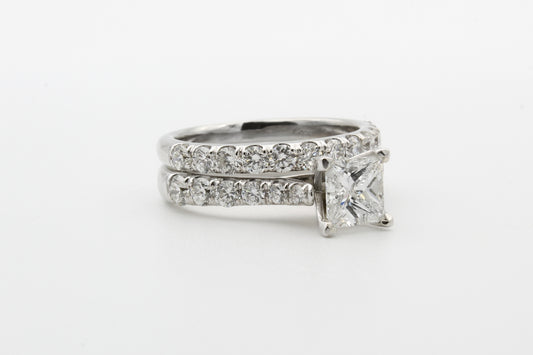 silver diamond ring on white surface