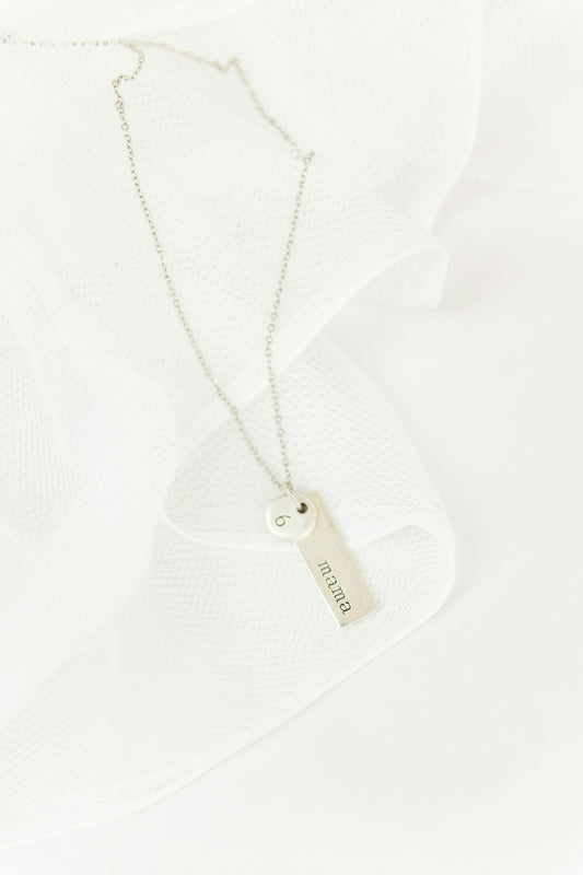 white and black cross pendant necklace