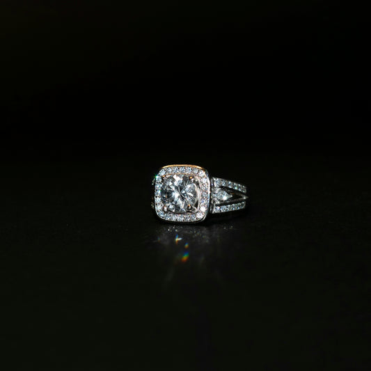 a diamond ring on a black surface