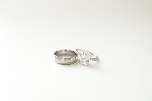 A couple of wedding rings sitting on top of a table