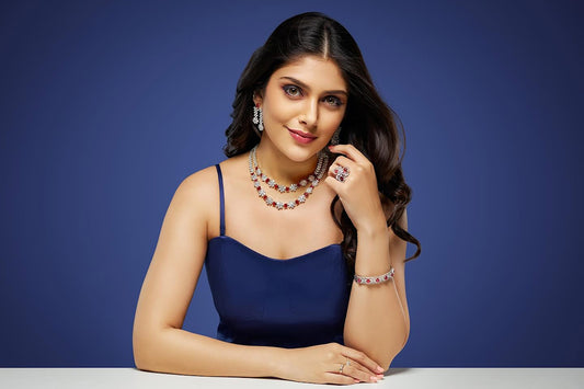 A woman in a blue dress sitting at a table