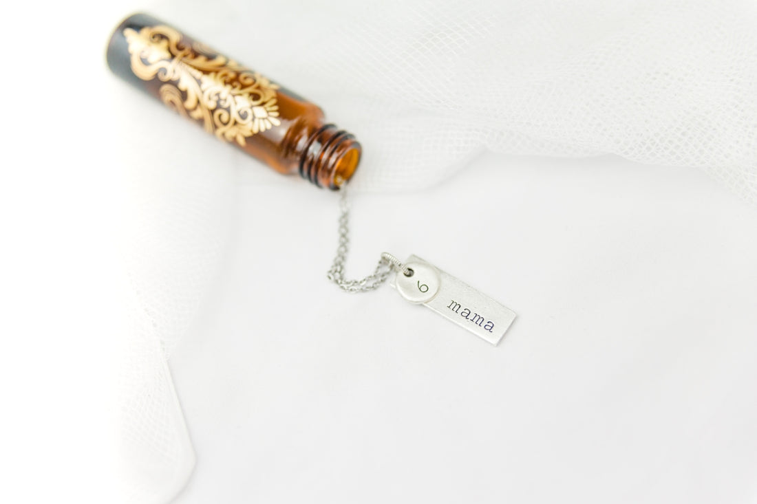 brown glass bottle on white textile