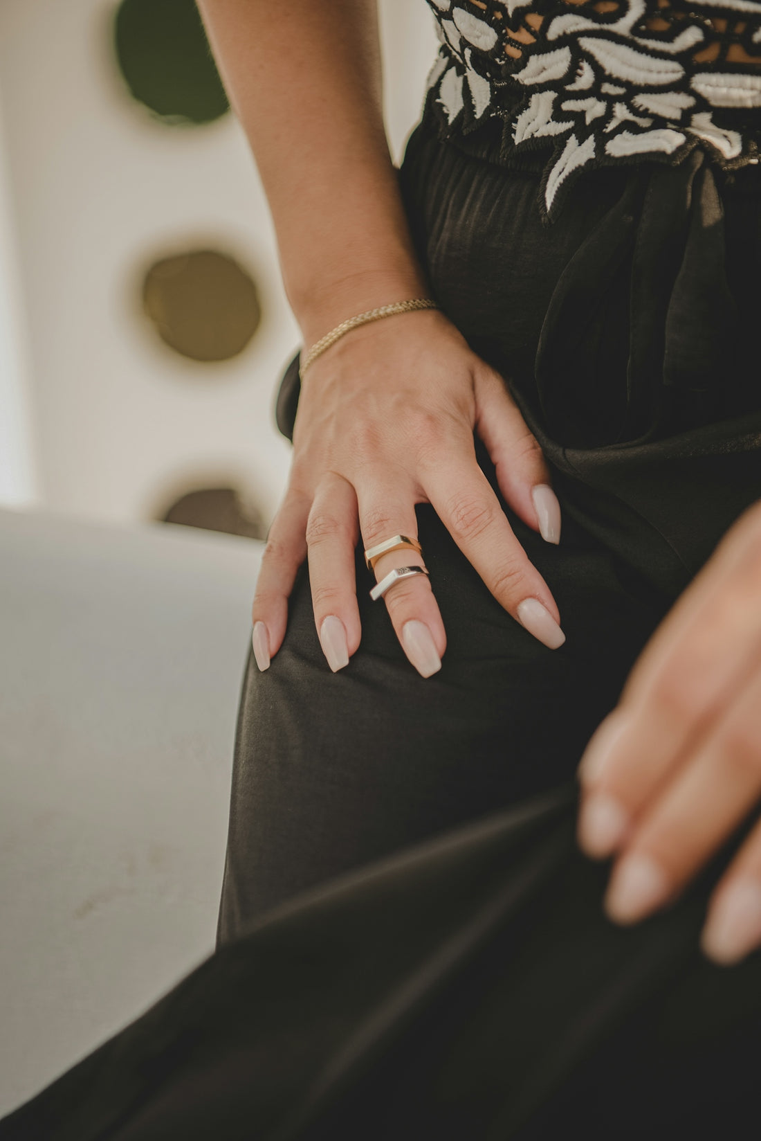 a woman's hand with a ring on her finger